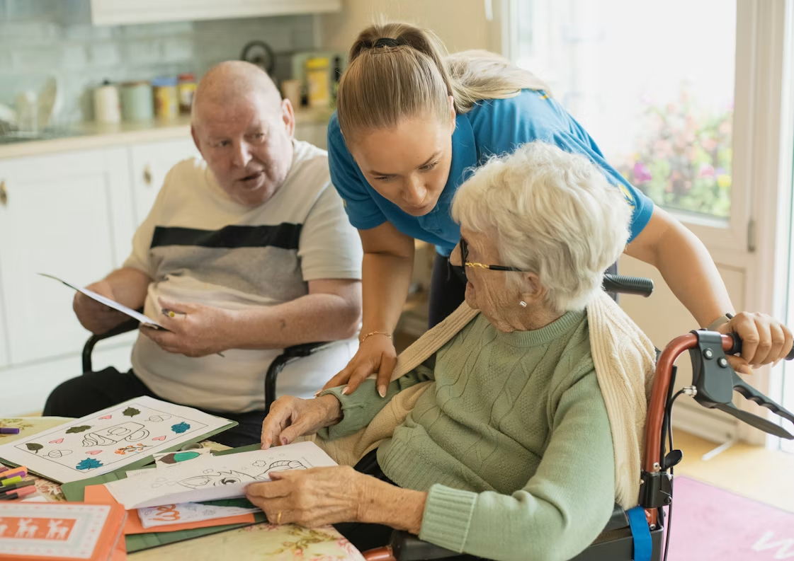 A caregiver providing compassionate support to an elderly client at home